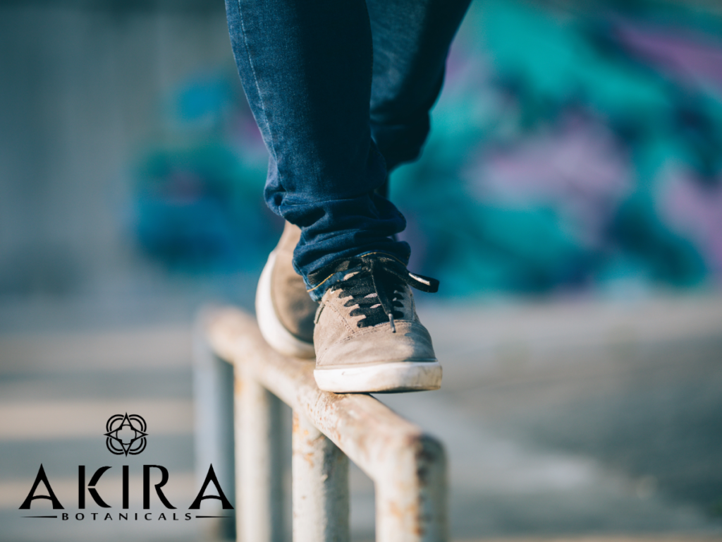 The Endocannabinoid System provides you with balance-Image of someone balancing on a railing.