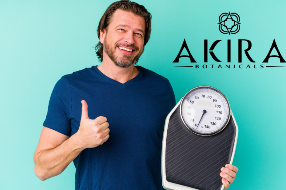THCv for weight loss - A man on a aqua background holding a scale.