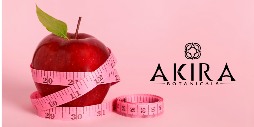 THCv for weight loss- an apple with a tape measure on a pink background.
