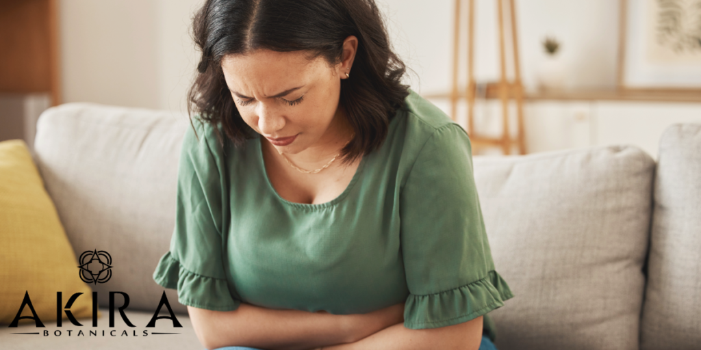 A woman experiencing stomach discomfort.