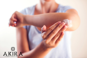 applying topicals to a sore elbow.